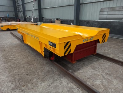 KPX akumuliatorius veikiantis V formos perdavimo vežimėlis